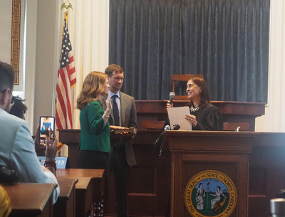 Justice Allison Riggs takes the oath of office administered by Justice Anita Earls.