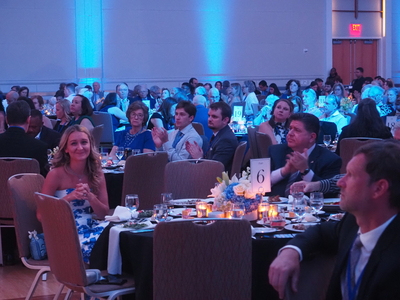 Anderson Clayton and JB Pritzker sit at a table marked “6.”