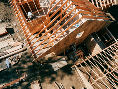 Workers build the frame of a new house project. (Getty Images/RyanJLane)