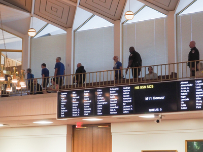 Chanting protesters escorted from the NC House gallery on Aug. 4, 2026. (Photo: Claire Michal/NC Newsline)