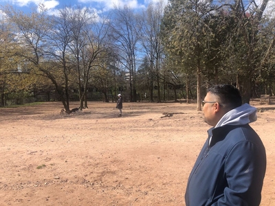 A man at a dog park.