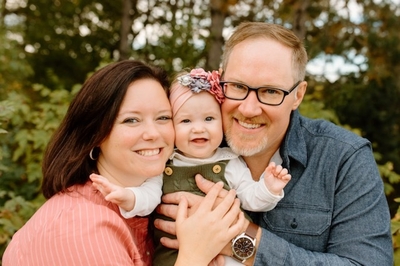 A couple with their daughter.