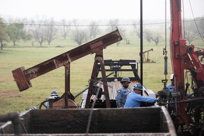Men work to plug an orphan well in Luling, Texas on March 27, 2025.