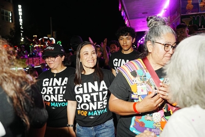 Gina Ortiz Jones attends the Flambeau parade with her staff after heading to a runoff election with 27.2% of the vote on election night.