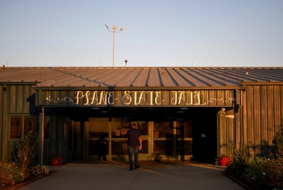 Tracy Williams, a reentry specialist who used to be incarcerated, walks into Plane State Jail to teach a Lee College course that focuses on reentry for women who are incarcerated at Lucile Plane State Jail in Dayton, Texas, US, on Monday October 28, 2024.