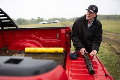 Plugging Contractor &amp; Owner of Bulldog Oil Well Services Randy Niedorf explains the use of the cast iron bridge plug on the site of an orphan well in a field in Luling, Texas on March 27, 2025.