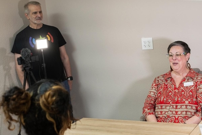 Pride Center Board President, Emily Parks answers interview questions from Texas Pride Impact Funds  members Ron Guillard and Míchél Macklin at Pride Center West Texas in Odessa on May 28,2024.