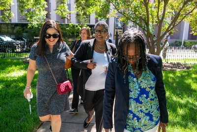 Texas Democrats Rep. Ana Hernandez, D-Houston, Toni Rose, D-Dallas and Sheryl Cole, D-Austin, r, get off a charter bus from the Austin airport outside the State Archives building on the east side of the Texas Capitol upon their return to Austin following a two-week quorum break.