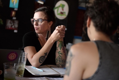 Lindsay London listens to Amarillo Reproductive Freedom Alliance members discuss strategy during a meeting, Sunday, April 28, 2024, at 806 Coffee  Lounge in Amarillo, Texas.