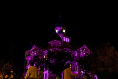The Denton Square Courthouse is lit purple during the month of October on Thursday, Oct. 17, 2024 in Denton, Texas. The city of Denton has been hosting activities all month long, hoping to become the Halloween capital of Texas.
