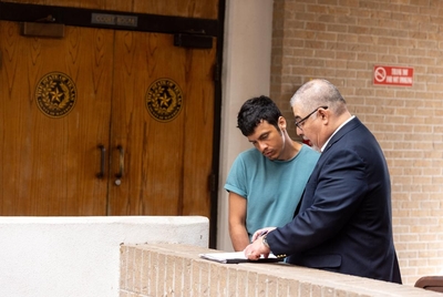 EAGLE PASS, TEXAS - November 7, 2024: David Burckhardt, 36, speaks to his lawyer after his hearing at Maverick County Courthouse. Ilana Panich-Linsman for The New York Times