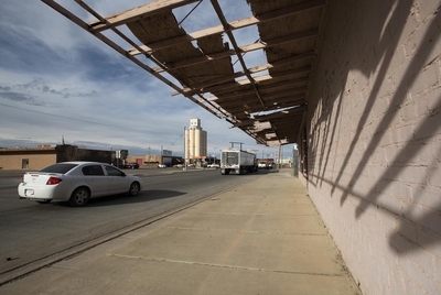 Cars pass through downtown Muleshoe, Texas, Monday, March. 6, 2023. (Justin Rex for The Texas Tribune)