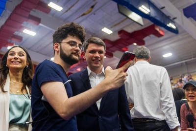 Texas Rep. James Talarico D-Austin takes a selfie with an attendeee during a redistricting rally at Delco Activity Center Friday, July 25, 2025 in Austin, Texas.