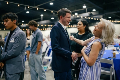 State Rep. James Talarico, D-Austin, laughs with an attendee during the Hays County Democrats' annual gala at Dripping Springs Ranch Park on Sunday, August 24, 2025.