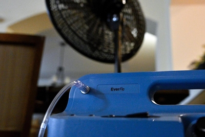 An oxygen concentrator sits next to a fan in a common area on Friday, July 12, 2024, at Ella Springs Senior Living Community in Houston, Tx. In order to maximize the effect of the generators, all of the 80 residents gathered into the common area to stay cool and keep life-saving medical equipment working. A family member of a resident said she was concerned about her loved one’s access to oxygen, as she was only able to get two tanks which last 11 hours each.