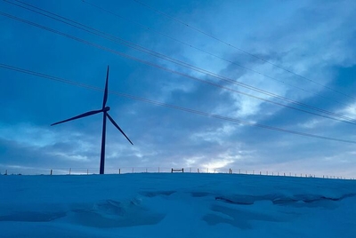 A wind turbine spins on a farmer's land near Aberdeen. (Joshua Haiar/South Dakota Searchlight)
