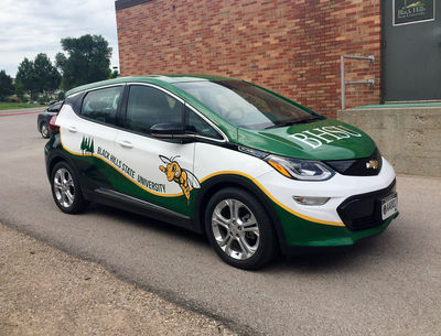 A Chevrolet Bolt owned by Black Hills State University is used by professors to drive between Rapid City and Spearfish. The all-electric vehicle saves the school money on fuel. (John Hult/South Dakota Searchlight)