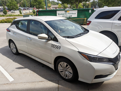 A Nissan Leaf electric vehicle parked outside the Health Department in Sioux Falls. The Leaf is the city's first all-electric vehicle. (John Hult/South Dakota Searchlight)