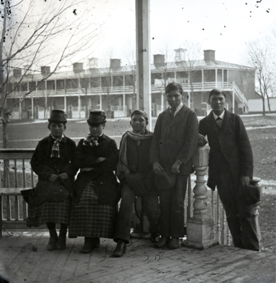 From left, Nancy Renville, Justine La Framboise, John Renville, Edward Upright and George Walker pose on the bandstand on the Carlisle school grounds in the late 1800s. Amos La Framboise is not pictured. The six children were members of the Spirit Lake and Lake Traverse bands of the Sisseton Wahpeton Oyate. (Photo by John Choate, courtesy of Carlisle Indian School Digital Resource Center)