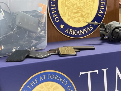 Cell phones that state officials said were seized from people incarcerated in state prisons on display at the Arkansas attorney general's office on Oct. 28, 2026.