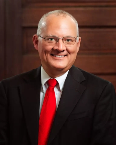 A photo of Castlen in a red tie.