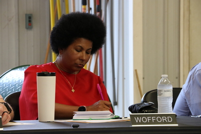 Wofford writes at her seat.