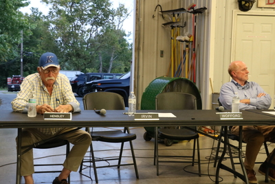 Two chairs sit empty as the council can't proceed with business. (Kentucky Lantern photo by Liam Niemeyer)