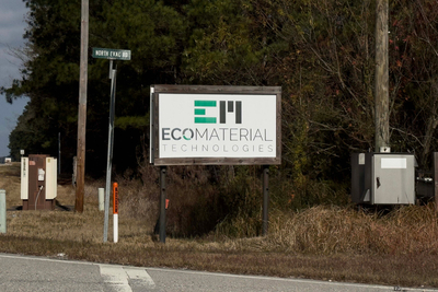 A sign on a road saying Eco Materials
