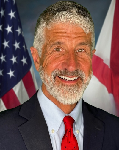A bearded man in suit