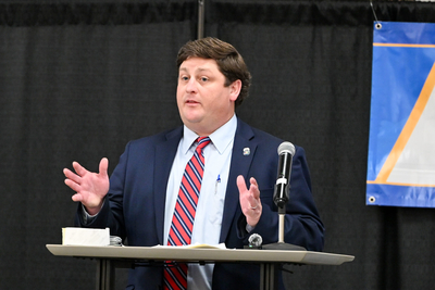 A man in a suit on stage