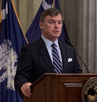 Corrections Director Bryan Stirling addresses reporters at the Statehouse