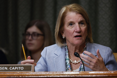 Sen. Shelley Moore Capito (R-WV) speaks during a Senate Appropriations Subcommittee hearing while gesturing with her left hand and holding a pencil in her right hand.