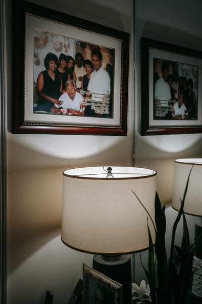 A number of framed family portraits in the Bishunauth home reflects the central role of family in their lives.