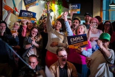 A group of people holding signs.