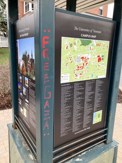 A green and black campus map station with red writing that says "Free Gaza."