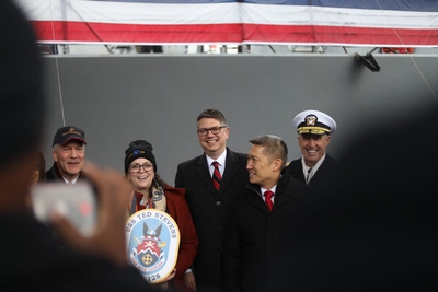 U.S. Rep. Nick Begich III, center, poses for a photo at a warship's commissioning ceremony in Whittier, Alaska, earlier this month. (Nathaniel Herz/Anchorage Press)