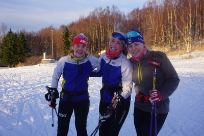 AAlaska Winter Stars skiers Olivia Soderstrom, Maddy Reckmeyer and Meredith Schwartz pose on Oct. 27 after practice at Anchorage's Kincaid Park. All Service High School students, they said they love Alaska's outdoor amenities but worry about the state's educational prospects. (Photo by Yereth Rosen/Alaska Beacon)