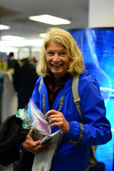 U.S. Sen. Lisa Murkowski, R-Alaska, stands in the Nome airport, holding a bag with chunks of graphite she received at Graphite One’s exploration project. (Photo by Berett Wilber for Northern Journal)