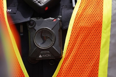 Honolulu Police Officer wears an AXON body camera outside district court. The charges of second-degree murder against officer Geoffrey H.L. Thom, 42, a five-year veteran of the force, and second-degree attempted murder against Zackary K. Ah Nee, 26, a three-year HPD veteran, and his partner Christopher J. Fredeluces, 40, who has 10 years of service with the department, were brought by criminal complaint after an Oahu grand jury declined to indict the officers.