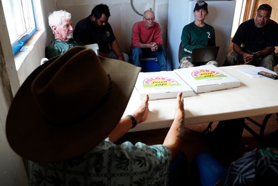 Molokaʻi cattle ranchers dealing with the state’s imposed bovine tuberculosis quarantine talk with Honolulu Civil Beat Wednesday, May 27, 2026, in Kaunakakai. They are, Uncle Phillip “Mango” Stephens, foreground, Kip Dunbar, from upper left, MP Kamakana, Jack Spruance, Steph Dunbar-Co and Charles Miguel, Jr. (Kevin Fujii/Civil Beat/2026)