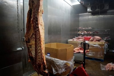 Half a cow hangs at the Molokaʻi Livestock Co-op’s slaughter house Wednesday, May 27, 2026, in Kaunakakai. (Kevin Fujii/Civil Beat/2026)