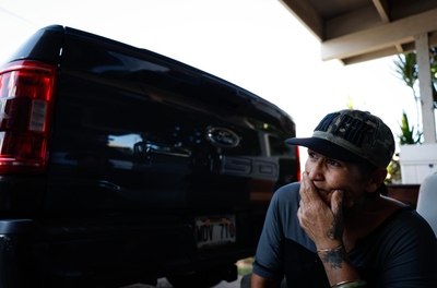 Kapu Shoaf sits in her garage, Monday, Oct. 12, 2026, in Honolulu.  (Jamm Aquino/Civil Beat/2026)