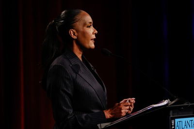 Bottoms faces empty podium on debate stage while Jackson campaigns with Kemp