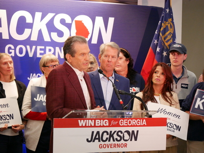 Bottoms faces empty podium on debate stage while Jackson campaigns with Kemp