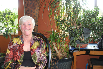 Kathryn Larson, a Democrat running for a seat in the Idaho House of Representatives, saw a doctor in the eastern Washington city of Spokane, more than an hour's drive from her community, to treat her prolapsed bladder. She is pictured sitting in front of a window lined with plants.