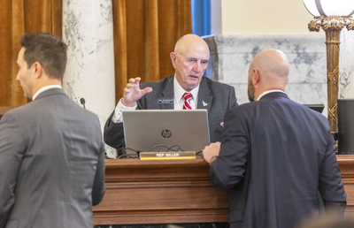 Rep. Steve Miller, R-Fairfield, (center) talks with a colleague during a Joint Finance-Appropriations Committee meeting