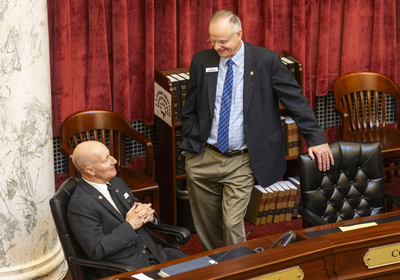 Sen. Doug Ricks, R-Rexburg, (right) chats with Sen. Dan Foreman, R-Moscow, on the Idaho Senate floor