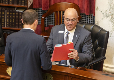 Sen. Van Burtenshaw, R-Terreton, (right) chats with Sen. Jim Woodward, R-Sagle, on the Senate floor