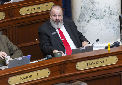 Rep. Dale Hawkins, R-Fernwood, listens to proceedings on the House floor
