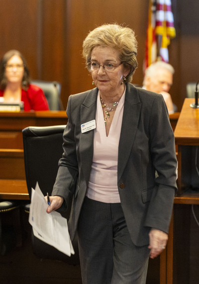 Jean Henscheid, co-president of the League of Women Voters of Idaho, walks away from the lectern after testifying at a Senate Health and Welfare Committee meeting